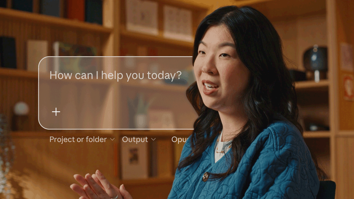 Claude 公告视频画面：统一的对话输入框，提示语为 How can I help you today?，下方带 Project or folder、Output 等选项